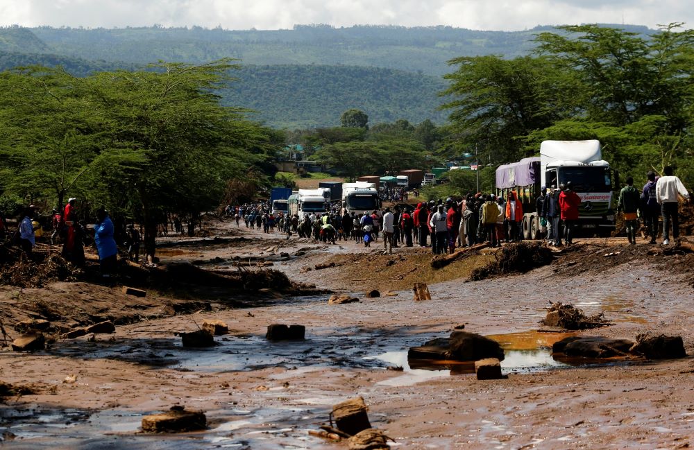 Residents and motorists are seen along the Mai Mahiu-Naivasha highway in the Kamuchiri village of Mai Mahiu in central Kenya's Nakuru County April 29, 2024, after heavy flash floods wiped out several homes when a dam burst, following heavy rains. (OSV News photo/Thomas Mukoya, Reuters)